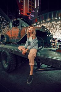 Read more about the article Nighttime Serenity: Woman’s solitude on a utility trailer