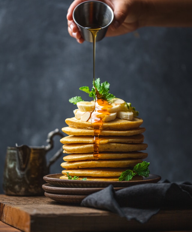 Read more about the article Sweet Delight: Drizzling honey over perfect pancakes